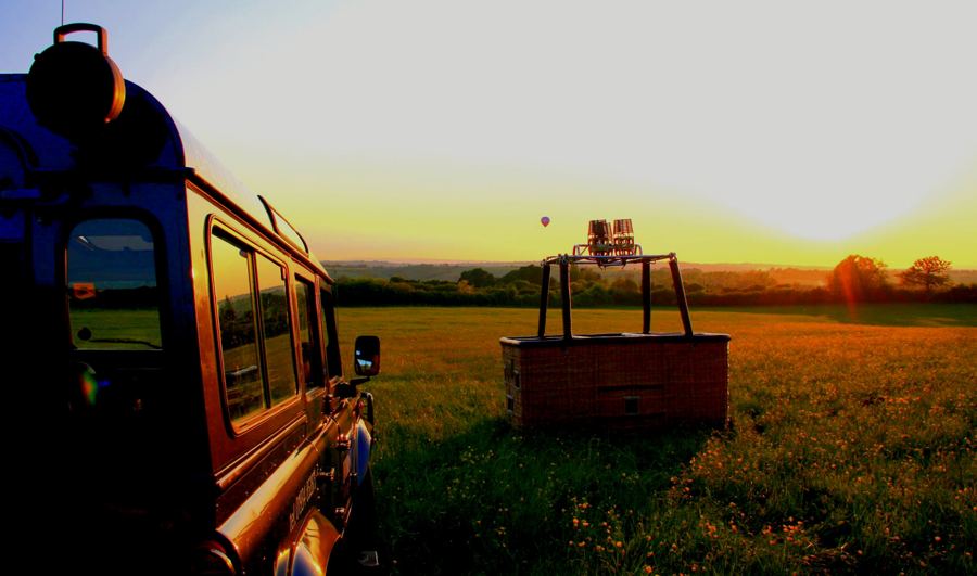 The basket and retrieve vehicle in a field at sunset
